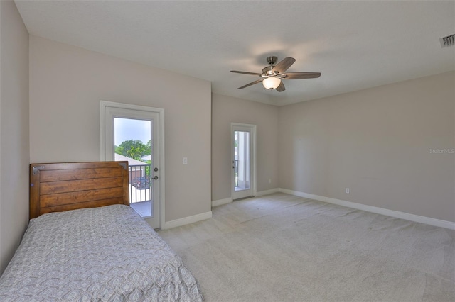 bedroom featuring access to exterior, multiple windows, light colored carpet, and baseboards