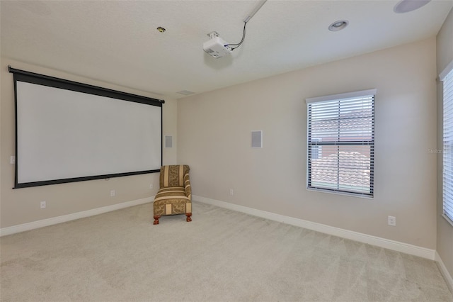 cinema featuring carpet flooring and baseboards