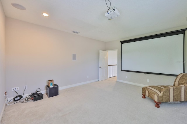 home theater room with light colored carpet, baseboards, and recessed lighting
