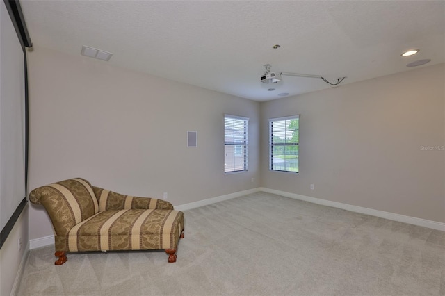 unfurnished room with light carpet, baseboards, and recessed lighting