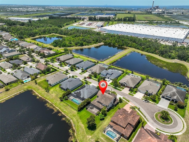 aerial view of residential area with a nearby body of water