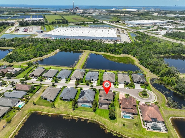 aerial perspective of suburban area featuring a large body of water