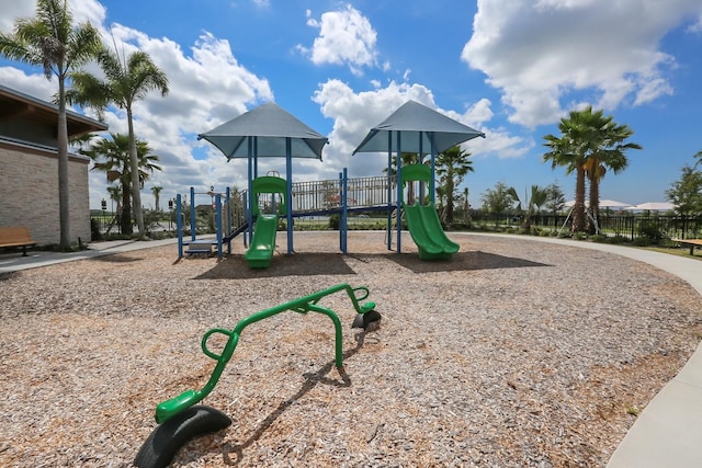 community jungle gym featuring fence