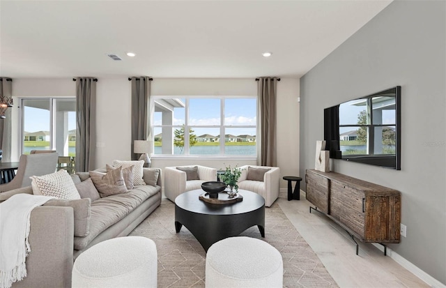 1075 Silverlake Blvd, Lake Alfred, FL 33850 - living room with plenty of natural light, recessed lighting, and baseboards