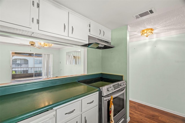 7701 Starkey Rd Unit 504, Seminole, FL 33777 - kitchen featuring stainless steel electric range, under cabinet range hood, white cabinets, dark wood-style flooring, and baseboards