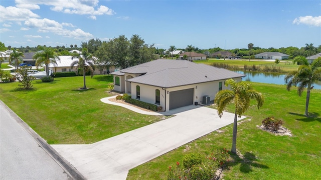 2484 SW 33rd Cir, Okeechobee, FL 34974 - ranch-style home featuring an attached garage, a residential view, a metal roof, a front lawn, and driveway
