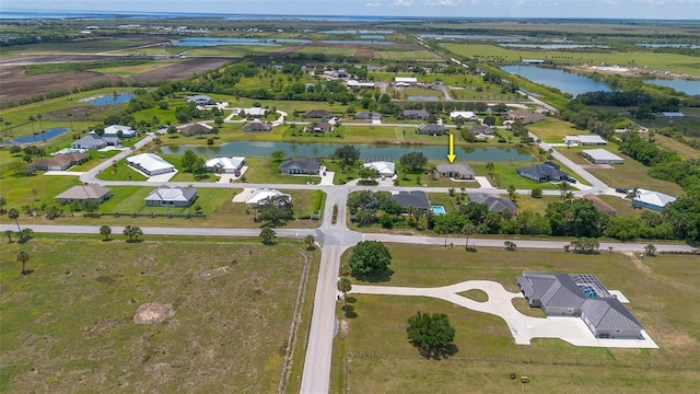 2484 SW 33rd Cir, Okeechobee, FL 34974 - aerial view of property and surrounding area with a nearby body of water and nearby suburban area
