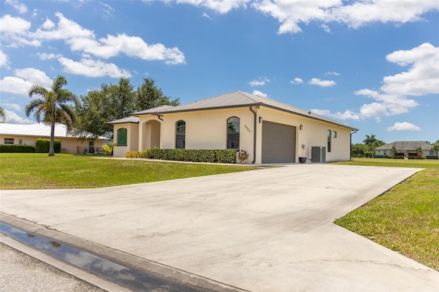 2484 SW 33rd Cir, Okeechobee, FL 34974 - ranch-style house with a garage, stucco siding, a front yard, driveway, and a metal roof