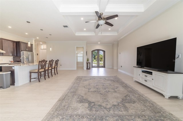 2484 SW 33rd Cir, Okeechobee, FL 34974 - living area with crown molding, ceiling fan, french doors, recessed lighting, and coffered ceiling