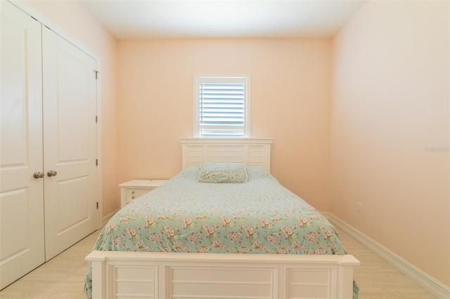 2484 SW 33rd Cir, Okeechobee, FL 34974 - bedroom with light wood-style floors and a closet