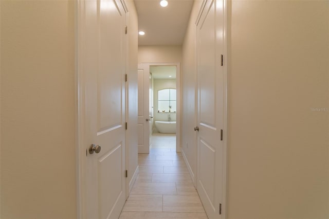 2484 SW 33rd Cir, Okeechobee, FL 34974 - hallway featuring recessed lighting and light tile patterned floors