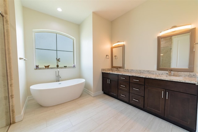 2484 SW 33rd Cir, Okeechobee, FL 34974 - bathroom featuring double vanity, a freestanding bath, and tiled shower