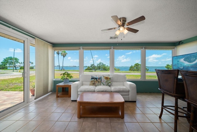 1963 Edgewater Dr, Clearwater, FL 33755 - sunroom featuring a textured ceiling and tile patterned floors