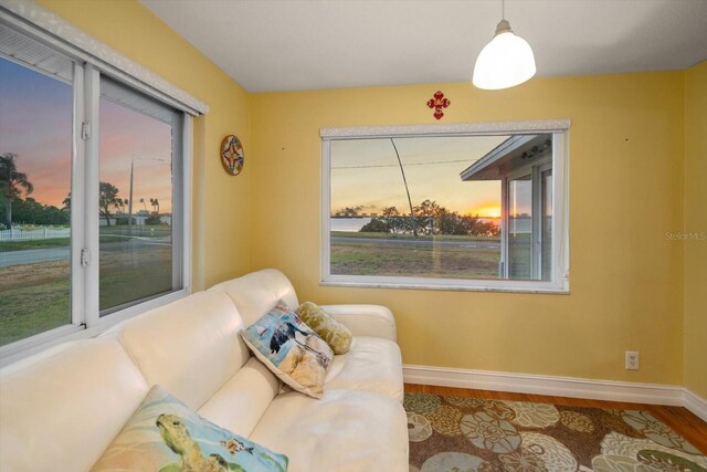 1963 Edgewater Dr, Clearwater, FL 33755 - sitting room with baseboards, wood finished floors, and plenty of natural light