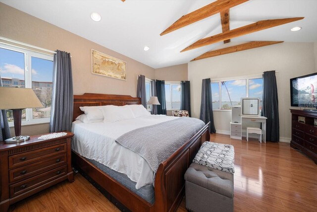 1963 Edgewater Dr, Clearwater, FL 33755 - bedroom with multiple windows, wood finished floors, recessed lighting, and baseboards