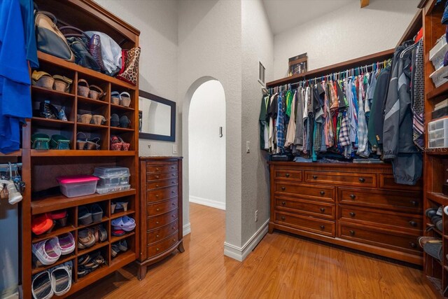 1963 Edgewater Dr, Clearwater, FL 33755 - spacious closet featuring arched walkways and wood finished floors