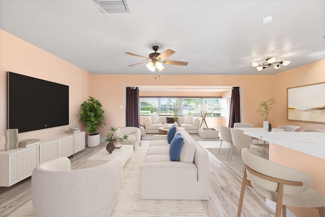 5108 Commonwealth Rd, Palmetto, FL 34221 - living area featuring wood finished floors and a ceiling fan