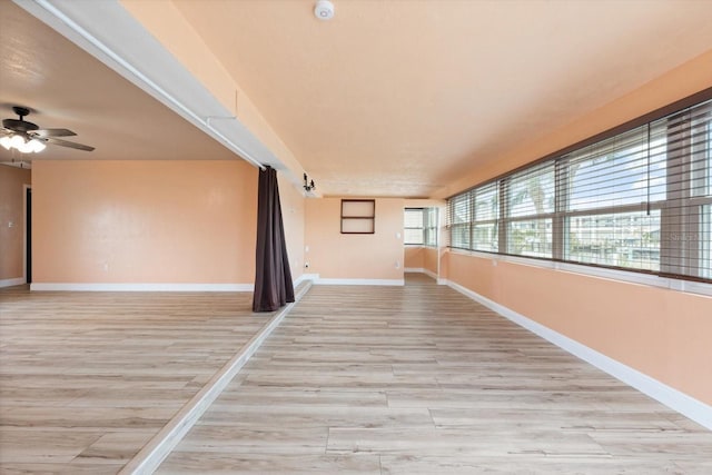5108 Commonwealth Rd, Palmetto, FL 34221 - empty room with light wood finished floors, baseboards, and a ceiling fan