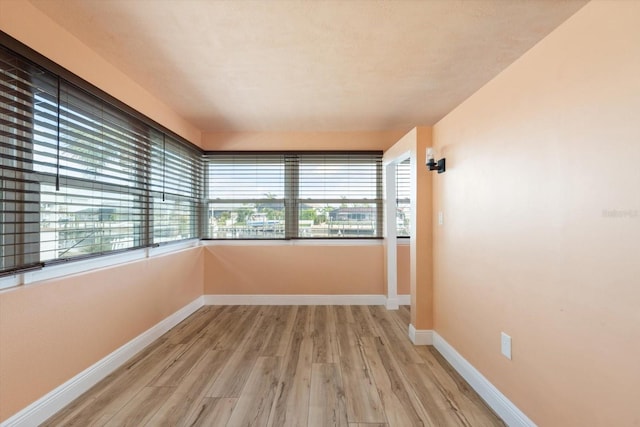 5108 Commonwealth Rd, Palmetto, FL 34221 - spare room with light wood-type flooring and baseboards