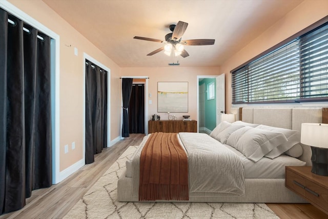 5108 Commonwealth Rd, Palmetto, FL 34221 - bedroom with light wood finished floors, baseboards, and a ceiling fan