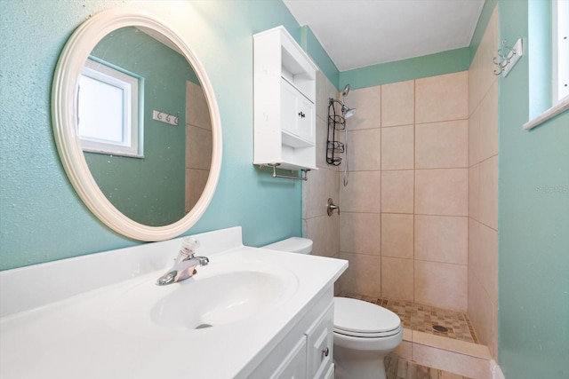 5108 Commonwealth Rd, Palmetto, FL 34221 - bathroom featuring toilet, tiled shower, and vanity