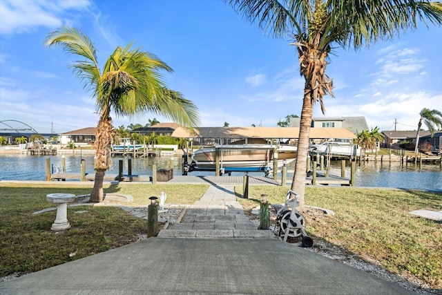 5108 Commonwealth Rd, Palmetto, FL 34221 - dock featuring boat lift, a yard, a water view, and a residential view