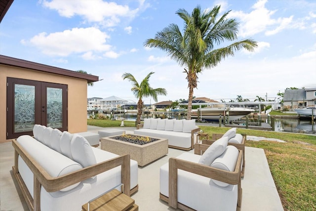 5108 Commonwealth Rd, Palmetto, FL 34221 - view of patio featuring boat lift, an outdoor living space with a fire pit, a boat dock, and a water view