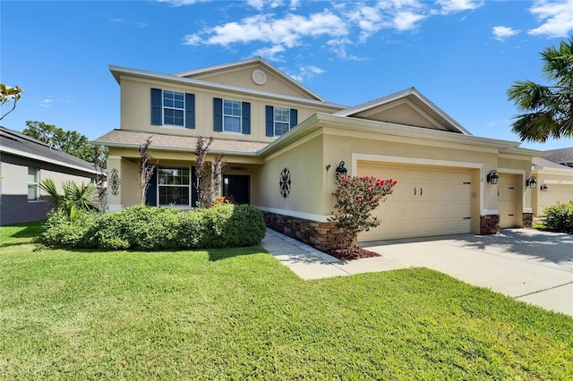 view of front facade featuring stucco siding, a front lawn, an attached garage, and driveway