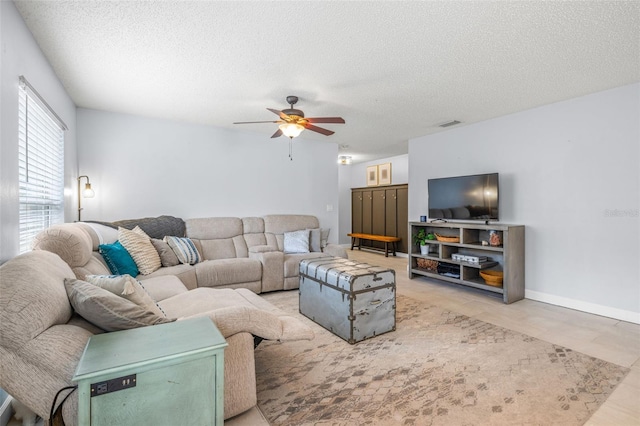 13643 Tramore Dr, Odessa, FL 33556 - living area with ceiling fan and a textured ceiling
