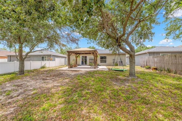 13643 Tramore Dr, Odessa, FL 33556 - rear view of house featuring a gazebo, a patio area, and stucco siding