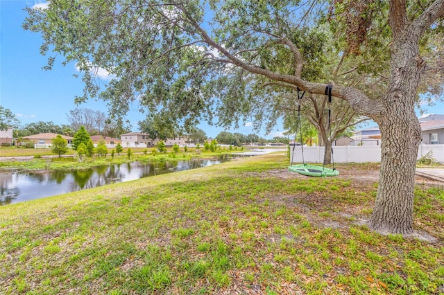 13643 Tramore Dr, Odessa, FL 33556 - view of yard featuring a water view, fence, and a residential view