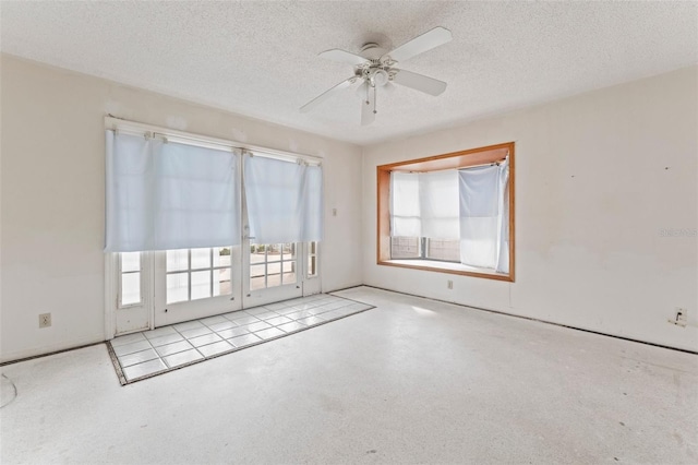 5 Marina Ter, Treasure Island, FL 33706 - spare room featuring a ceiling fan and a textured ceiling