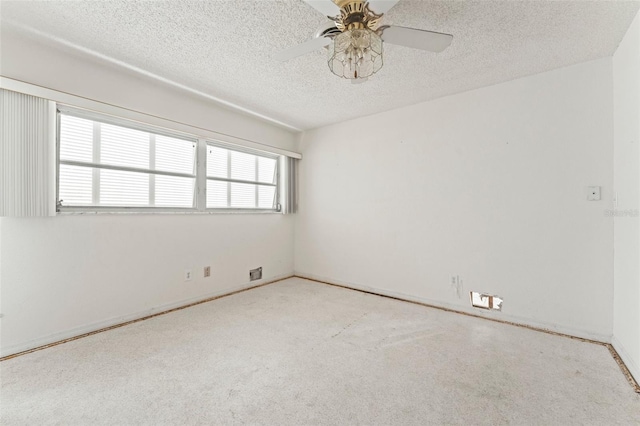 5 Marina Ter, Treasure Island, FL 33706 - carpeted empty room featuring a textured ceiling, a ceiling fan, and baseboards