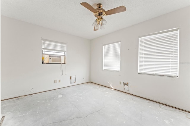 5 Marina Ter, Treasure Island, FL 33706 - empty room featuring cooling unit, plenty of natural light, and a ceiling fan