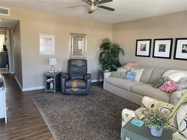 8455 112th St Unit 212, Seminole, FL 33772 - living area with a ceiling fan, dark wood finished floors, baseboards, and a textured ceiling