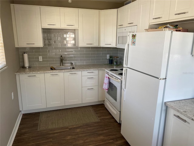 8455 112th St Unit 212, Seminole, FL 33772 - kitchen featuring white appliances, a sink, dark wood-type flooring, and tasteful backsplash