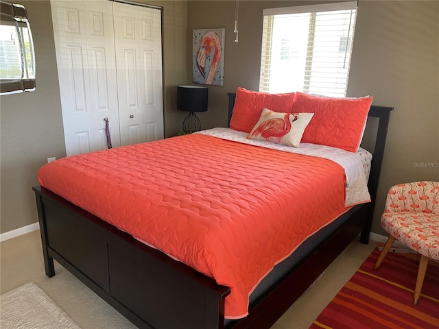 8455 112th St Unit 212, Seminole, FL 33772 - bedroom with baseboards and a closet