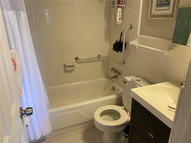 8455 112th St Unit 212, Seminole, FL 33772 - full bathroom with toilet, tile walls, shower / bath combination with curtain, vanity, and tile patterned flooring