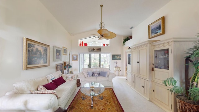 living area featuring ceiling fan, light colored carpet, and high vaulted ceiling