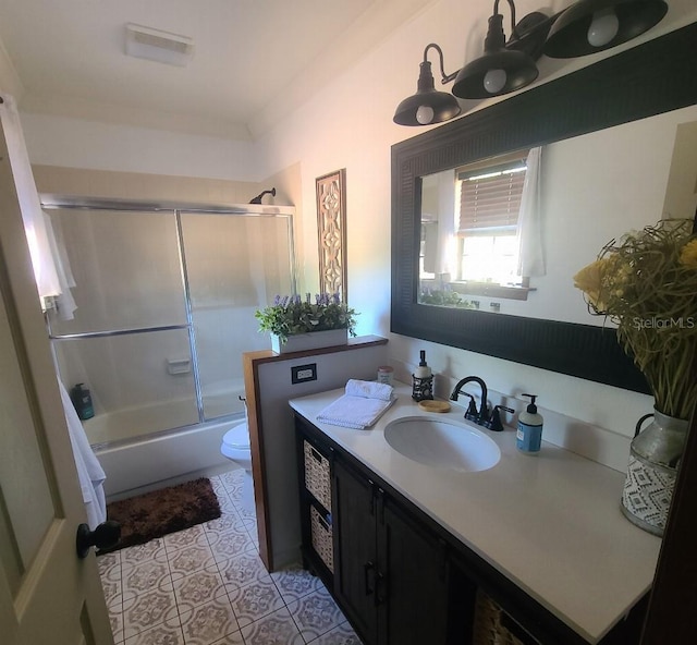 314 Bloomingfield Dr, Brandon, FL 33511 - bathroom with toilet, vanity, combined bath / shower with glass door, and tile patterned floors