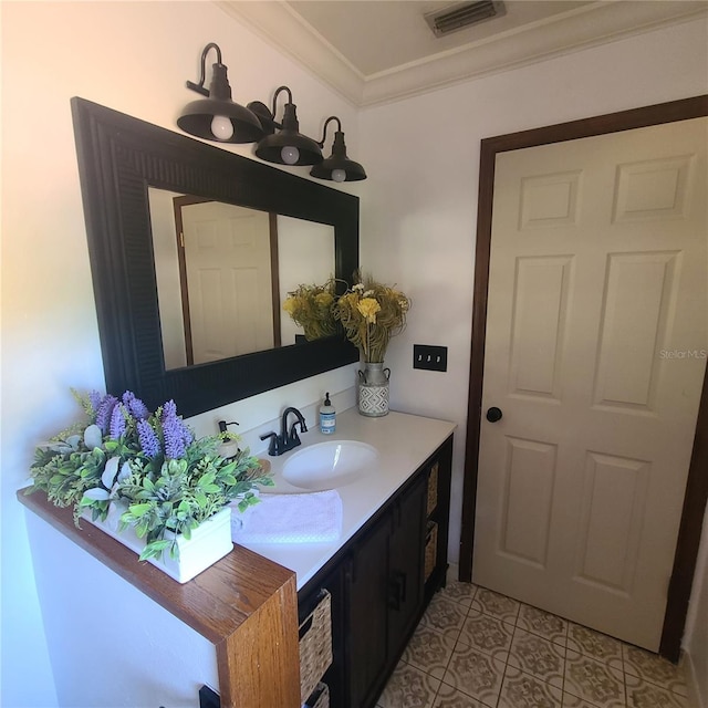 314 Bloomingfield Dr, Brandon, FL 33511 - bathroom with ornamental molding, vanity, and tile patterned floors