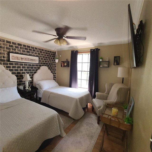 314 Bloomingfield Dr, Brandon, FL 33511 - bedroom featuring crown molding, wood finished floors, a textured ceiling, and a ceiling fan