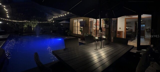 314 Bloomingfield Dr, Brandon, FL 33511 - pool at night featuring an outdoor pool