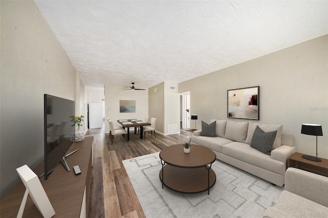 2002 Australia Way E Unit 66, Clearwater, FL 33763 - living room featuring wood finished floors, a textured ceiling, and ceiling fan