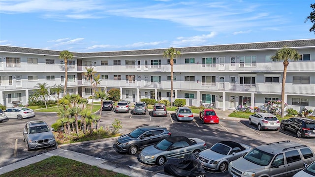 2002 Australia Way E Unit 66, Clearwater, FL 33763 - view of apartment building / complex featuring uncovered parking