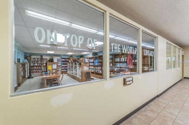 2002 Australia Way E Unit 66, Clearwater, FL 33763 - hallway with tile patterned floors and a paneled ceiling