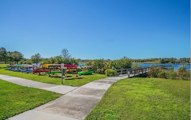 2002 Australia Way E Unit 66, Clearwater, FL 33763 - view of home's community featuring a lawn and a water view