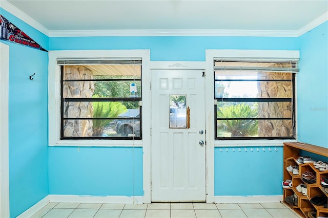 9802 N Oregon Ave, Tampa, FL 33612 - entrance foyer with ornamental molding, light tile patterned floors, and baseboards