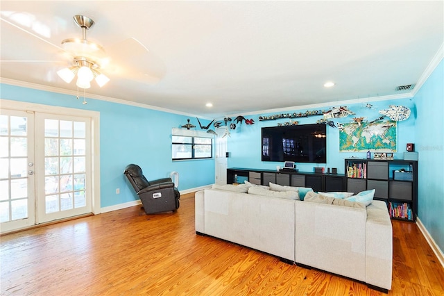 9802 N Oregon Ave, Tampa, FL 33612 - living area featuring ornamental molding, wood finished floors, baseboards, ceiling fan, and plenty of natural light
