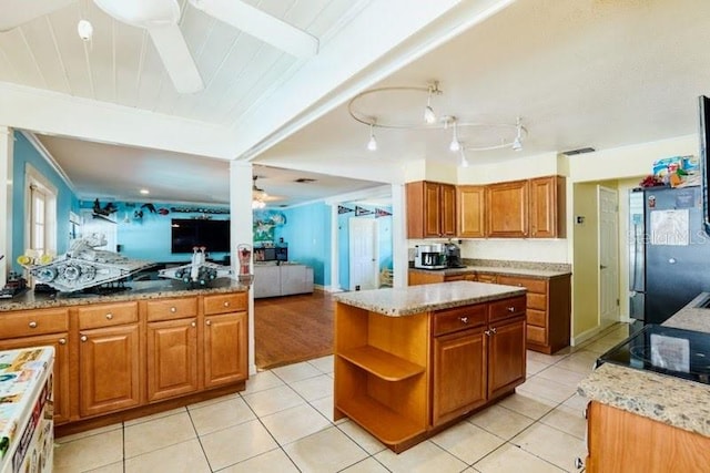 9802 N Oregon Ave, Tampa, FL 33612 - kitchen with brown cabinetry, light stone counters, light tile patterned floors, and open shelves